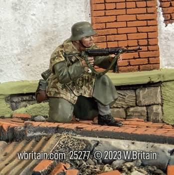 WW2: German Grenadier Kneeling Firing MP40 in Zeltbahn and Greatcoat Winter 1944-45