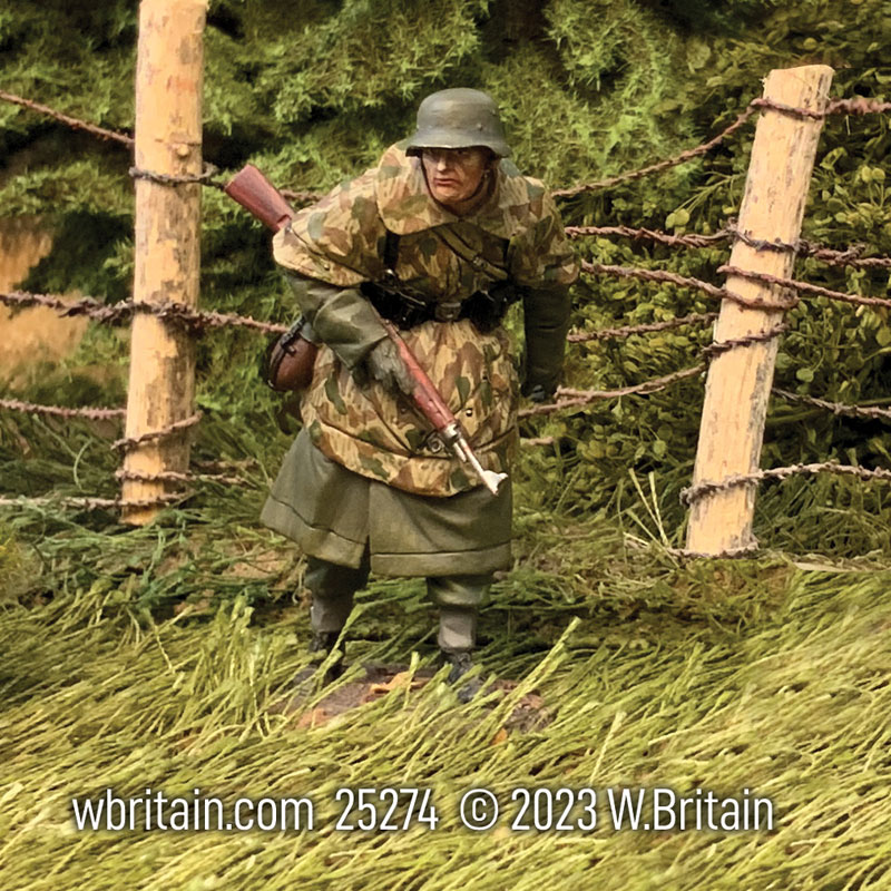 WW2: German Grenadier in Greatcoat and Zeltbahn Advancing Cautiously Winter 1944-45